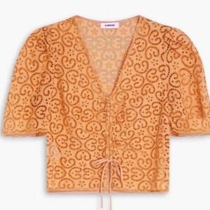 Sandro Orange eyelet V-Neck short sleeve Blouse. Front tie. Side zipperLike New!